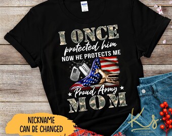 May include: Black t-shirt with a camouflage print and the text "I ONCE protected him NOW HE PROTECTS ME" with a camouflage American flag and a dog tag with the name "JAMES". The text "Proud Army MOM" is printed below the flag.