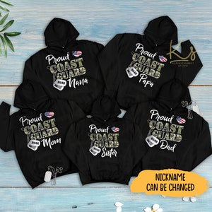 May include: Five black hooded sweatshirts with a camouflage pattern and the text "Proud Coast Guard" with a small American flag and a dog tag with the word "Noah" on it. The text below the dog tag says "Nana", "Mom", "Sister", "Dad", and "Papa".