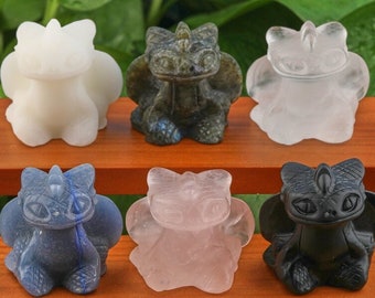 May include: Six small dragon figurines carved from different types of stone. The dragons are in various colours, including white, grey, clear, blue, pink, and black.