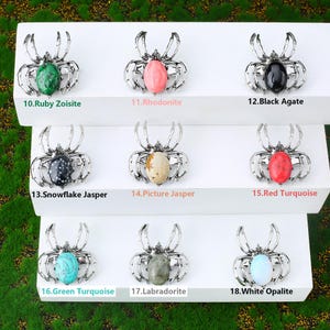 Handcrafted natural crystal spider featuring a polished gemstone body set in a finely crafted alloy spider frame. designed with natural stones creating a luxurious and artistic jewelry piece. The smooth gemstone surface and detailed spider legs give it a striking and elegant appearance. Perfect as a pendant necklace or brooch accessory symbolizing creativity, protection, and good fortune. Ideal for meditation energy healing, spiritual balance, fashion styling, gift giving, and decorative display