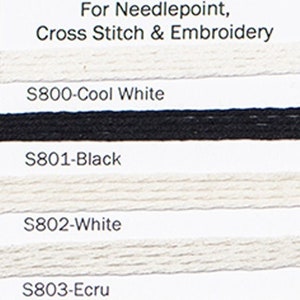 May include: A color chart of Splendor silk thread for needlepoint, cross stitch, and embroidery. The chart displays various thread colors, including black, white, pink, purple, and coral. The text "Splendor" is at the top.