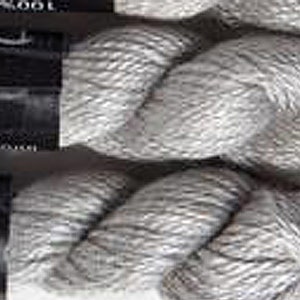 May include: Close-up of several skeins of gray yarn. The yarn is tightly wound, showing a textured surface. The labels are black with white text. The yarn appears to be 100% cotton.