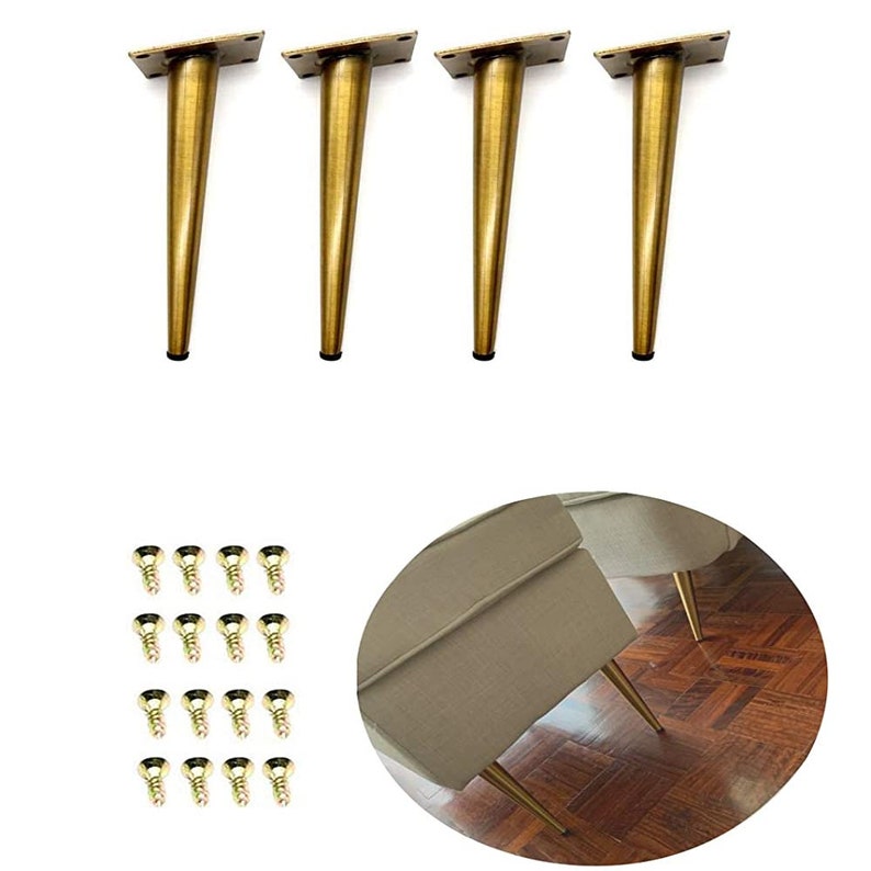 May include: Set of four gold metal furniture legs with a tapered design. The legs are 6 inches tall and come with screws for installation.