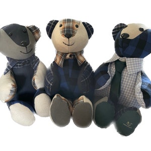 May include: Three handmade teddy bears wearing plaid shirts and ties. The bears are sitting together on a white background.
