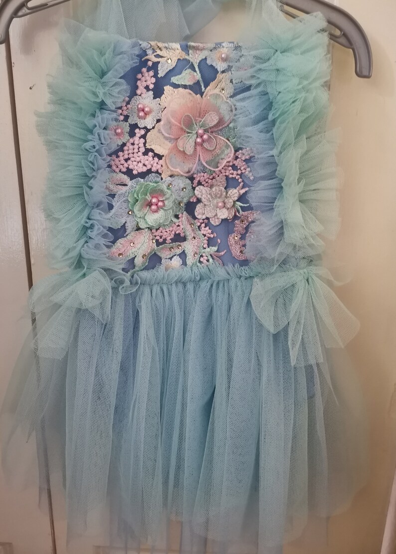 beautiful romper in aquamarine-blue color