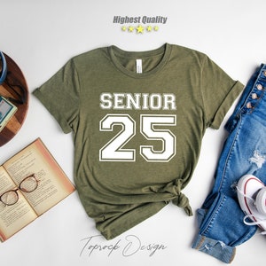May include: A green t-shirt with white text that says "Senior 25".