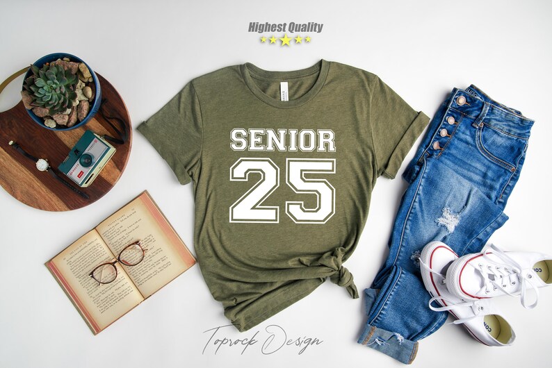 May include: A green t-shirt with white text that says "Senior 25".
