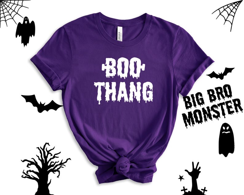 May include: Purple short-sleeved t-shirt with the text "BOO THANG" in white dripping letters.