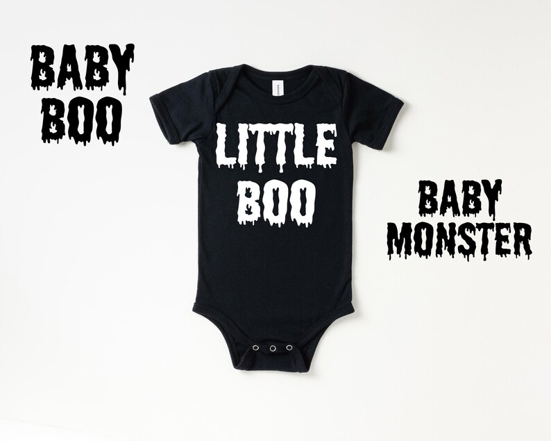 May include: Black bodysuit with white text that reads "Little Boo" on a white background.  Two additional images show the text "Baby Boo" and "Baby Monster" in black.