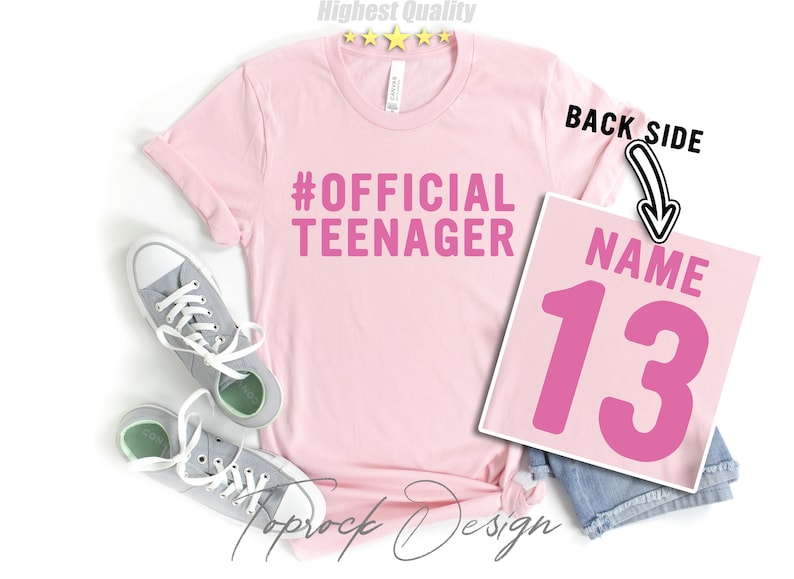 May include: Pink t-shirt with the text "#OFFICIAL TEENAGER" on the front and a pink number "13" with the word "NAME" above it on the back.