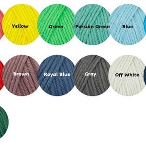 May include: A color chart of yarn with 36 different colors. The colors are arranged in three rows of 12. The colors include white, pale blue, orange, coral, yellow, green, Persian green, blue, capri blue, pink, lime green, purple, burgundy, black, moss green, red, brown, royal blue, gray, off white, navy blue, bright orange, natural, forest green, tan, mustard, dusty pink, and emerald green.
