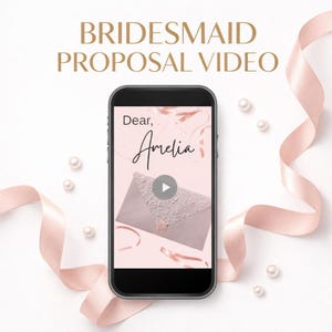 May include: A smartphone displays a video with the text "Bridesmaid Proposal Video." The screen shows a pink envelope with the name "Amelia" and a play button. Pink ribbon and pearls decorate the background.