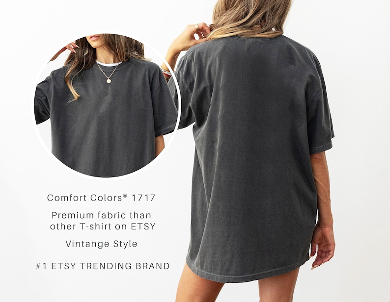 May include: A dark gray Comfort Colors 1717 t-shirt with a vintage style. The shirt is oversized and has short sleeves. The text on the image reads "Premium fabric than other T-shirt on ETSY" and "#1 ETSY TRENDING BRAND."