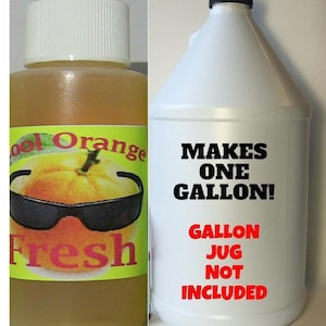 May include: A small bottle of orange-scented liquid with a label that says "Cool Orange Fresh" and a cartoon orange wearing sunglasses. A larger white plastic jug with a black lid and a label that says "Makes One Gallon! Gallon Jug Not Included".