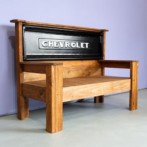 May include: A white ceramic mug with a black handle and the text "But First, Coffee" in a handwritten style. The mug is on a white surface. The mug is 4 inches tall.