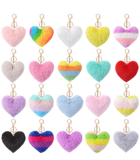 and pompoms heart fluffy shape. Keychain with name
