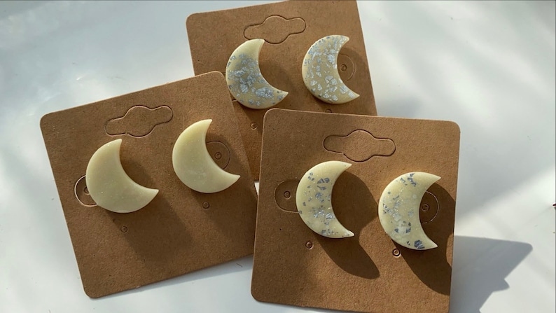 Glow in the dark crescent moon studs