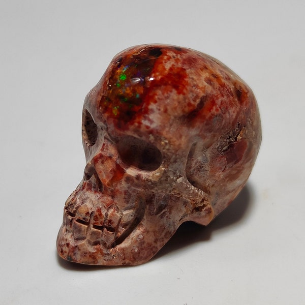 Top Opale de feu Noble - Crâne sculpté - Mexique - 62 ct