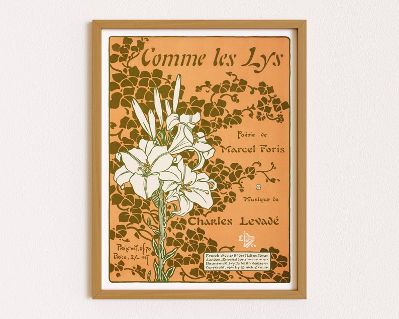 May include: A framed vintage art print featuring a floral design with the text "Comme les Lys." The artwork showcases white lilies and green foliage against an orange background. The print includes text indicating the poem's author, the composer, and the publisher.