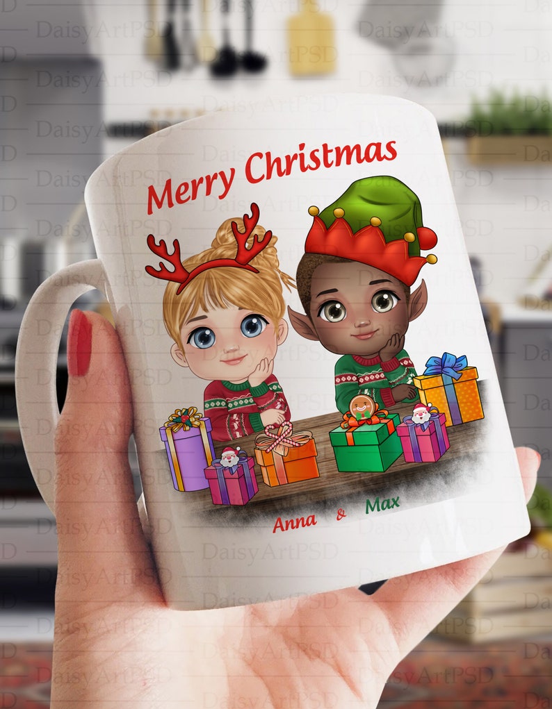May include: White ceramic mug with a Christmas theme. The mug features a cartoon illustration of a girl with blonde hair wearing a red sweater and a boy with brown skin wearing a green elf hat and a red sweater. The mug has the text "Merry Christmas" and "Anna & Max" printed on it.