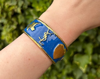 Vintage Y S L Laurent Ycons blue enamel bracelet cuff with gold tone star  heart dove