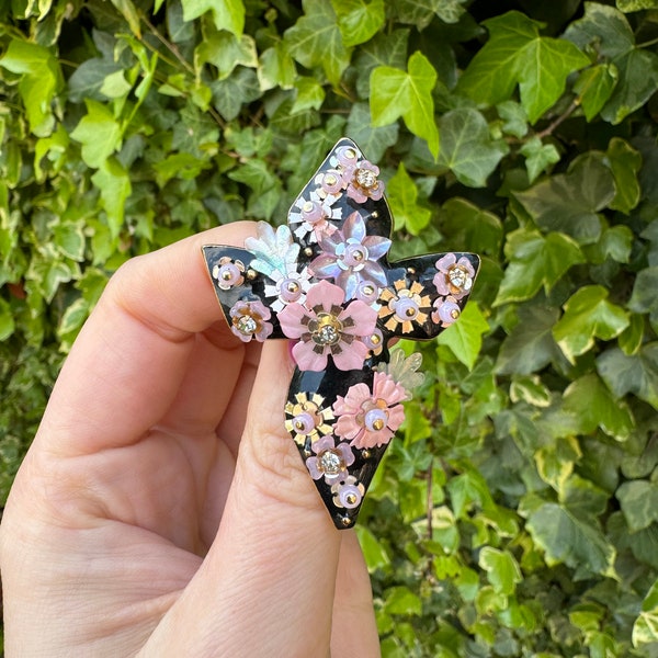 Vintage Christian Lacroix cross brooch with black enamel and flower sequins