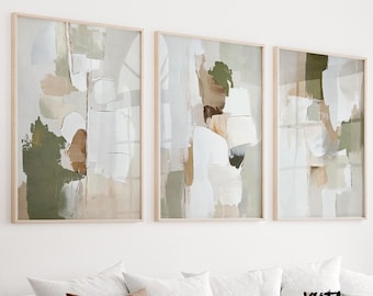 May include: Three framed abstract art prints. Each print features a mix of neutral colors, including white, beige, and olive green, with a layered, textured appearance. The artwork is displayed above a white couch with decorative pillows.