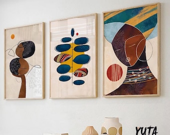 May include: Three abstract art prints with a modern minimalist style. The prints feature a blue and yellow leaf, a brown and white abstract figure, and a brown face with a blue and yellow headdress.