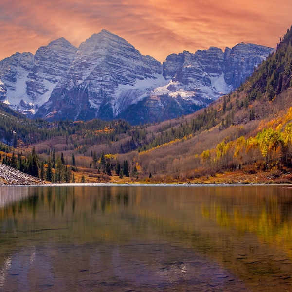 Colorado - Maroon Bells Spectacular sunset panoramic scene: Alpenglow, snow on the mountains, Aspen fall color, all reflected in the water