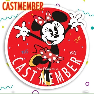 May include: A red circle with the text "CAST MEMBER" around the edge. In the center is a cartoon image of Minnie Mouse in a red and white polka dot dress, jumping and smiling. The text "Walt Disney World." is below Minnie Mouse.