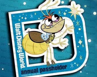 May include: A blue and yellow sticker with a cartoon firefly character. The sticker says "Walt Disney World" and "annual passholder".