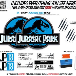 May include: A collection of Jurassic Park-themed decals and stickers. Includes two 23x17 inch blue logos, predator scratches, JP18 decals, holographic decals, and install tools. The image also features the text "Jurassic Park".