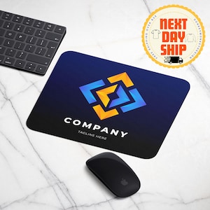 May include: A blue and yellow geometric logo on a dark blue mousepad with the text "COMPANY TAGLINE HERE".