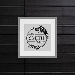 May include: A black and white framed print with a floral design and the text "The SMITH family" in a circle.