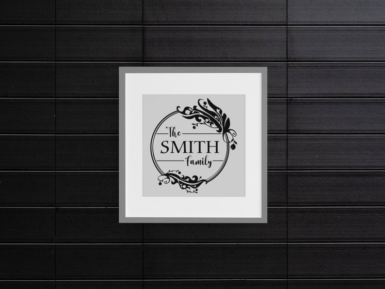 May include: A black and white framed print with a floral design and the text "The SMITH family" in a circle.