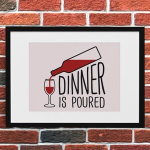 May include: A black framed print with a white background and a red wine bottle pouring into a wine glass. The text "Dinner is poured" is written in black below the image.