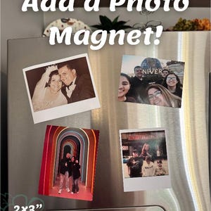 May include: A stainless steel refrigerator door displays four photo magnets. The magnets feature family photos and are available in 2x3 inch or 4x6 inch sizes. The text "Add a Photo Magnet!" is at the top.