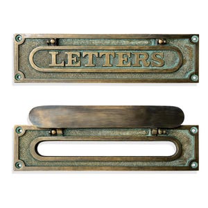 May include: A rectangular brass letter plate with a weathered green patina finish. The top plate features the word LETTERS in raised lettering. The bottom plate includes a hinged flap that covers a horizontal opening for mail delivery.
