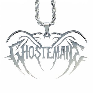 May include: Silver chain necklace with a pendant featuring the word "GHOSTMAN" in a stylized, gothic font.