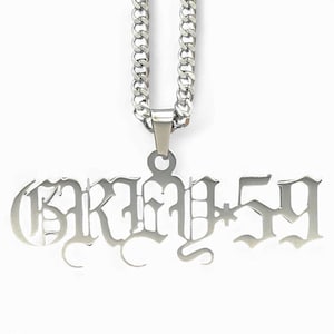 May include: Silver chain necklace with a pendant that says "GRIM 59" in a gothic font.