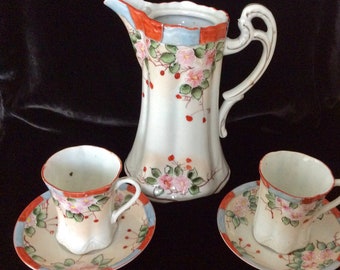 A Stunning Antique Nippon Chocolate Teapot, cups and saucers