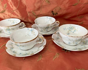A group of 4 Theodore Haviland Limoges France Cups/saucer sets