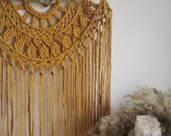 Mustard yellow half Mandala inspired macrame wall hanging. Feature wall. Boho style macrame. Interior design. Bedroom. living room. Wall art