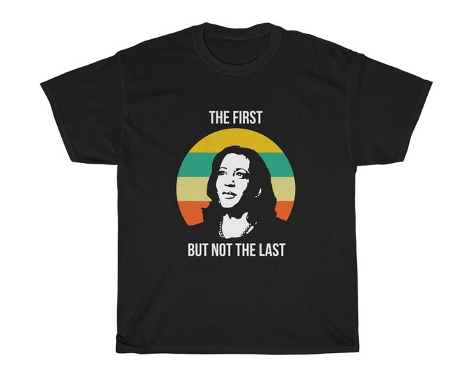 The First But Not the Last commemorates an iconic quote from our vice president-elect, Kamala Harris. Unisex Heavy Cotton Tee