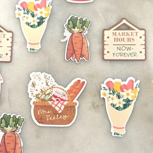 May include: A collection of colorful stickers featuring a market theme. Designs include bouquets of flowers, carrots, a picnic basket with bread, and a sign that reads "MARKET HOURS NOW-FOREVER". The stickers are in various shapes and sizes.