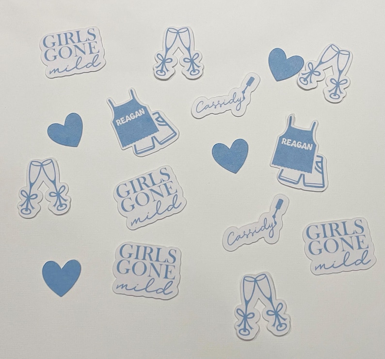 May include: A collection of blue and white stickers with various designs, including hearts, champagne glasses, and text that reads "Girls Gone Mild" and "Cassidy".