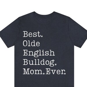 May include: A dark blue t-shirt with white text that reads "Best. Olde English Bulldog. Mom. Ever."