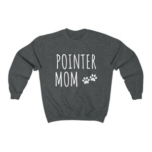 May include: A dark heather grey sweatshirt with the text "POINTER MOM" and two white paw prints.