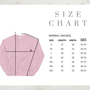 May include: A light pink sweatshirt with a size chart. The chart displays measurements in inches for length, width, and sleeve length, ranging from size small to 4XL. The text "SIZE CHART" is at the top.