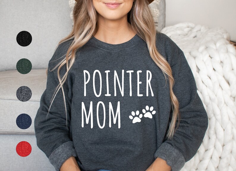 May include: A dark gray sweatshirt with the text "POINTER MOM" and two white paw prints.